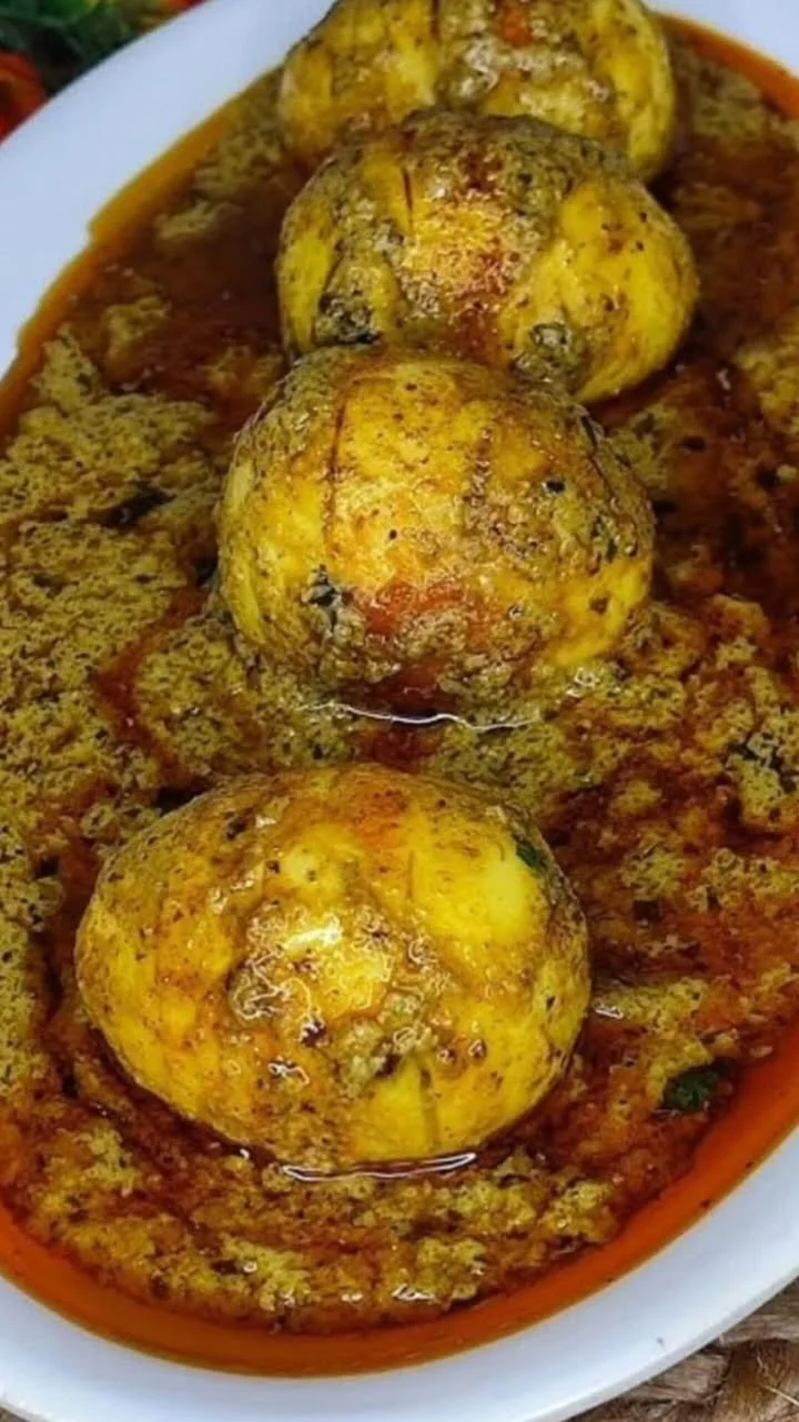 Delicious Afghani Egg Curry dish garnished with spices and herbs