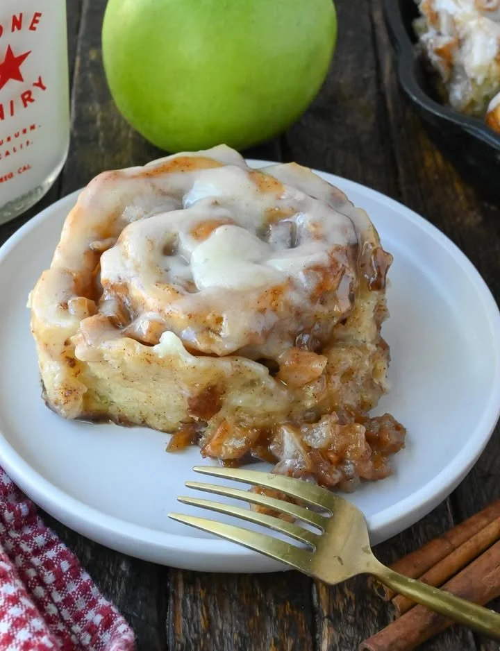 Freshly baked apple pie cinnamon rolls with cinnamon and apple filling
