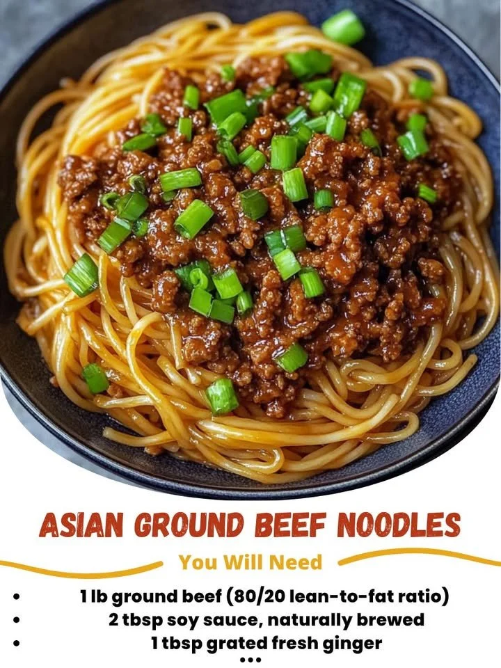 Bowl of savory Asian ground beef noodles garnished with fresh herbs.