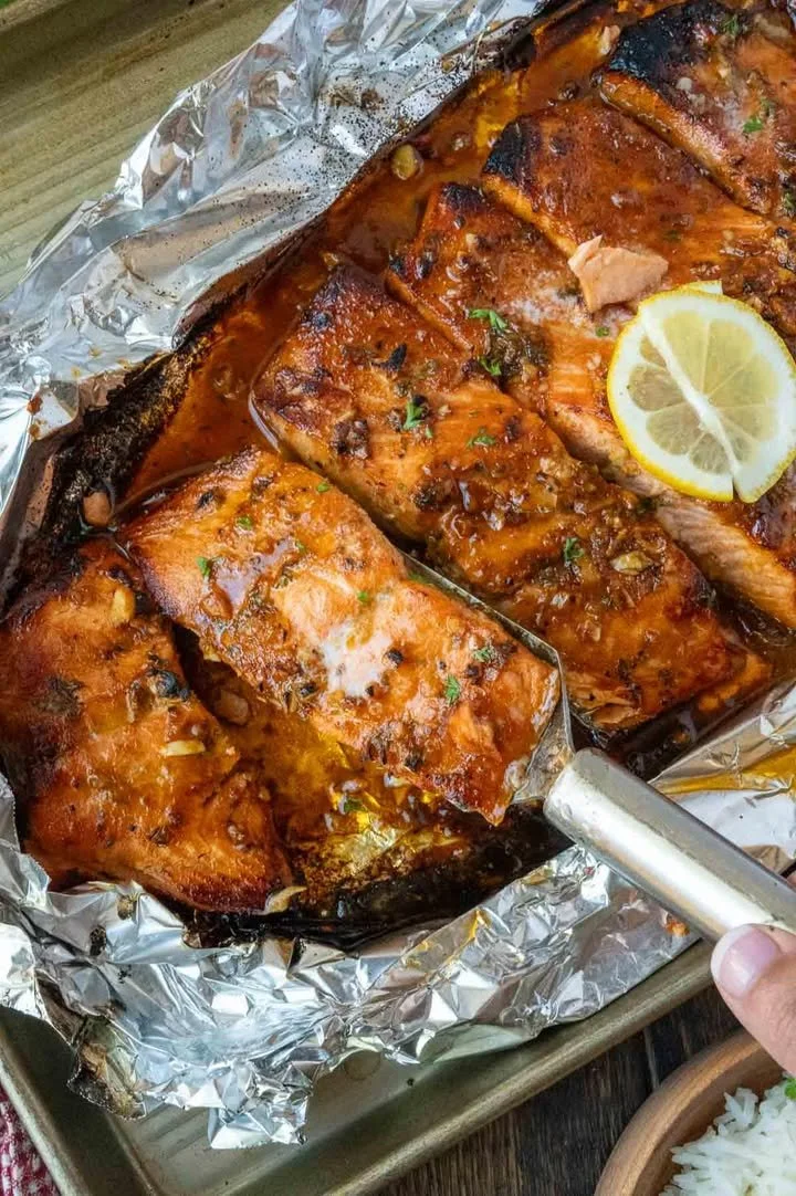 Baked Steelhead Trout Delicious Baked Steelhead Trout garnished with herbs and lemon slices