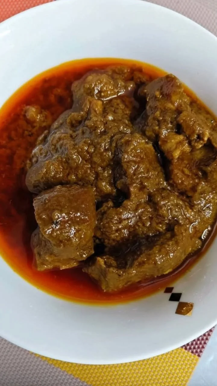 Home-style beef curry recipe with spices and tender beef served in a bowl.