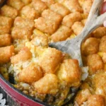 home Delicious Big Mac Casserole topped with cheese and garnished with lettuce and pickles.