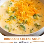 Creamy broccoli cheese soup in a bowl garnished with fresh broccoli florets