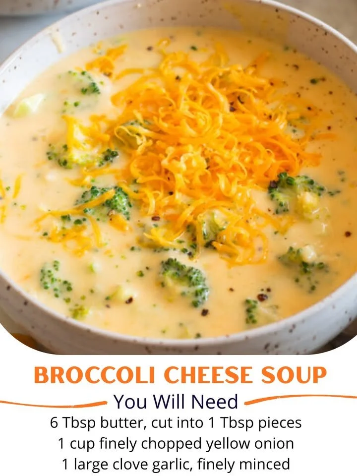 Creamy broccoli cheese soup in a bowl garnished with fresh broccoli florets