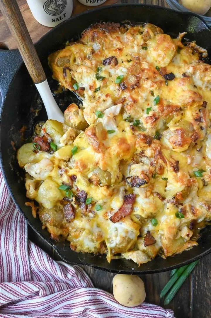 Chicken Bacon Ranch Potato Casserole topped with crispy bacon and cheese