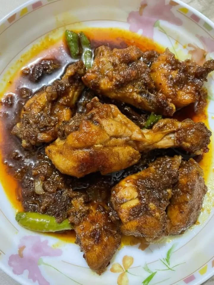 Delicious Chicken Bhuna dish garnished with fresh herbs and spices.