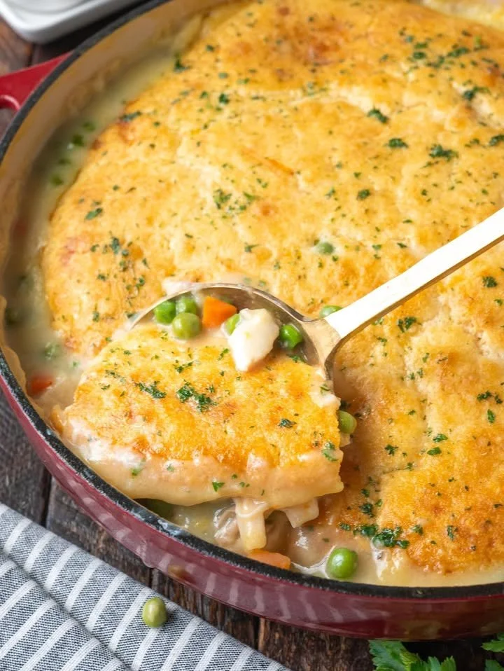 Delicious Chicken Cobbler Casserole topped with flaky crust and fresh vegetables