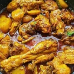Delicious Chicken Masala Curry in a vibrant bowl with spices and herbs