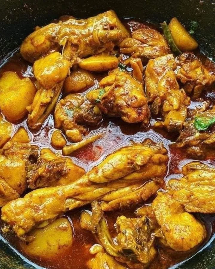 Delicious Chicken Masala Curry in a vibrant bowl with spices and herbs