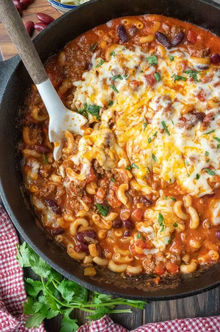 Delicious Chili Macaroni Casserole topped with cheese and herbs