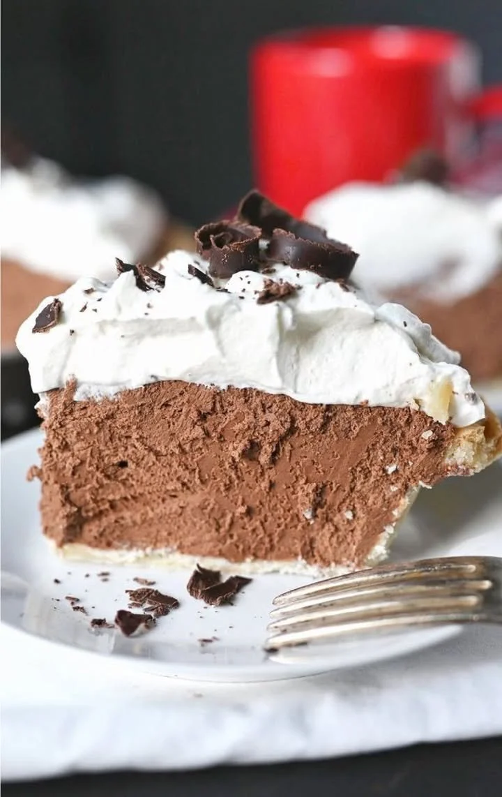 Delicious homemade Chocolate Cream Pie topped with whipped cream and chocolate shavings.
