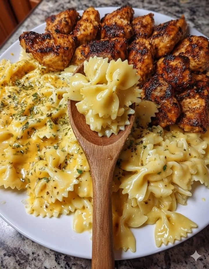 Creamy garlic butter Cajun chicken bowtie pasta dish on a plate
