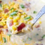 home Bowl of creamy sweet corn chowder topped with fresh herbs.