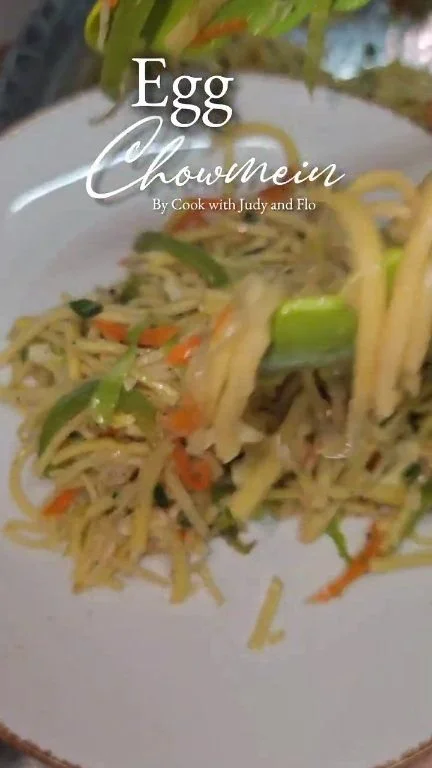 A delicious plate of Egg Chowmein with vegetables and scrambled eggs