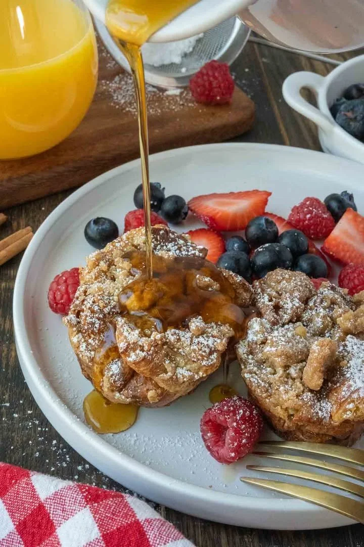 French Toast Muffins French Toast Muffins baked golden brown with syrup and powdered sugar on top