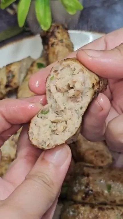 Delicious Fried Seekh Kebabs served on a platter with chutney and salad.