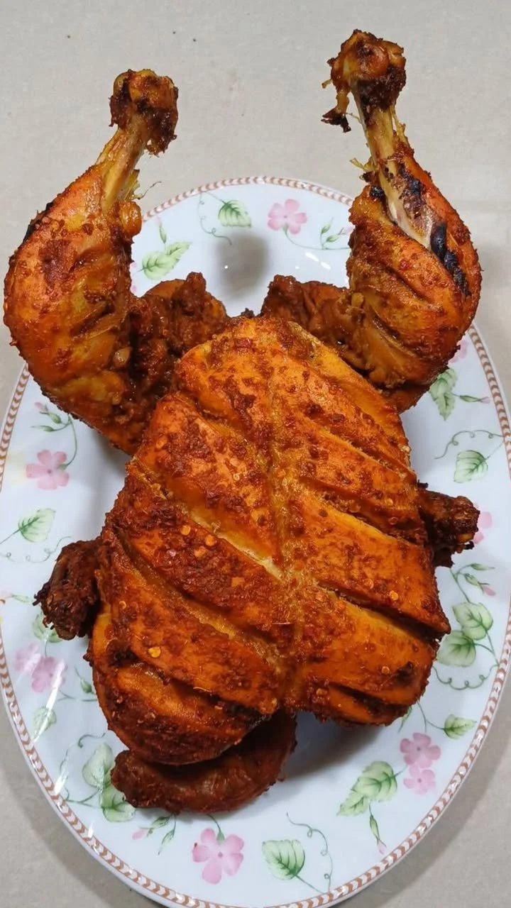 Delicious full chicken steam roast garnished and ready to serve