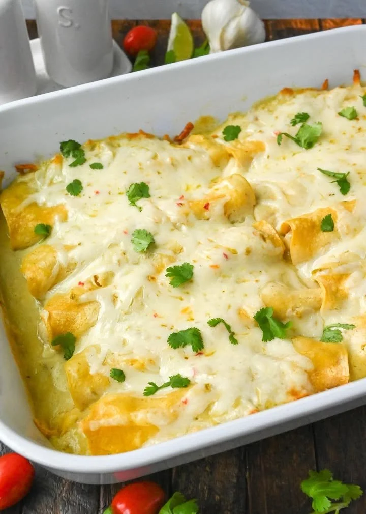 Delicious Green Chile Chicken Enchiladas topped with green sauce and cheese