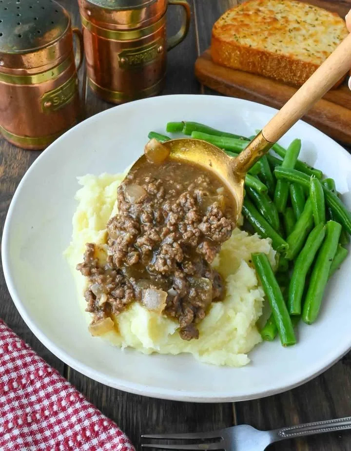 Bowl of ground beef and gravy served with mashed potatoes