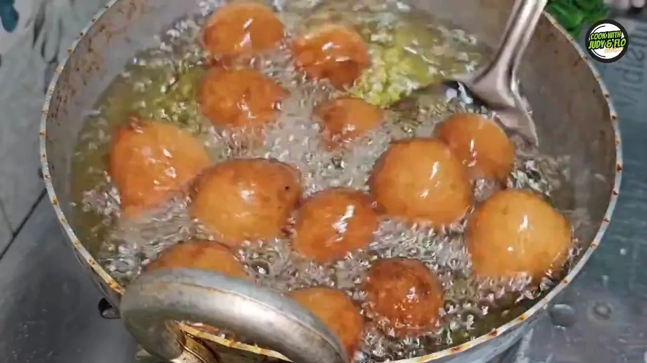 A plate of Gulgule, traditional Indian sweet made from flour and jaggery.