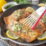 Herb grilled salmon garnished with fresh herbs and served on a plate