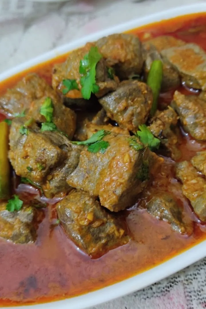 Delicious Liver Masala served with spices and herbs