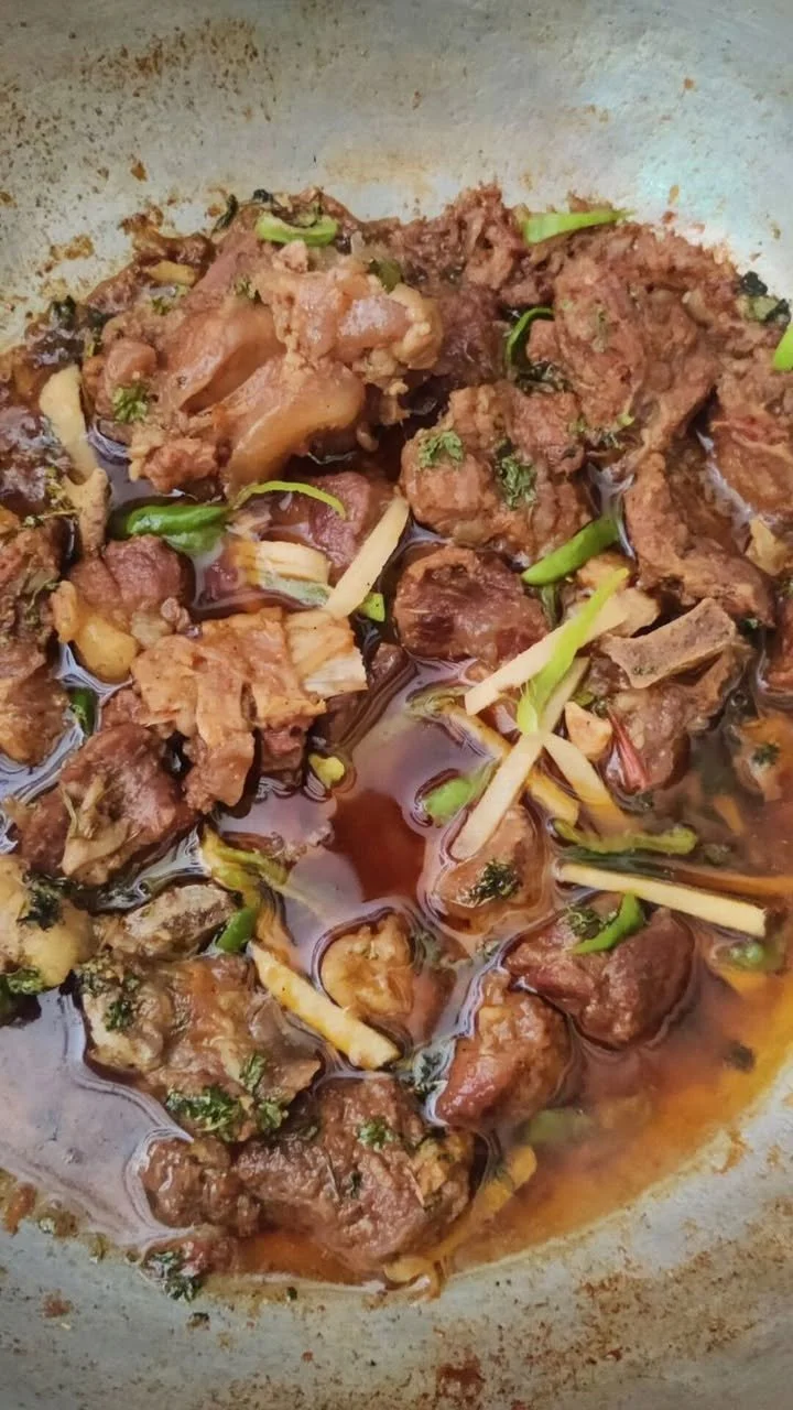 Delicious mutton karahi served in a traditional pan with spices and garnish