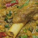 home Bowl of flavorful mutton stew with tender pieces of meat and vegetables