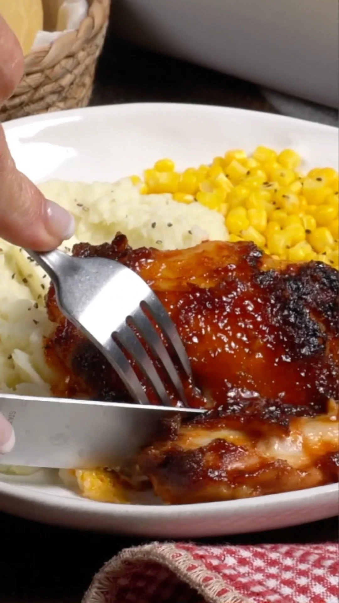 Oven-Baked BBQ Chicken Oven-baked BBQ chicken with a delicious glaze roasting in the oven