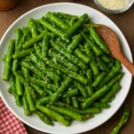 Delicious pan fried asparagus served on a plate
