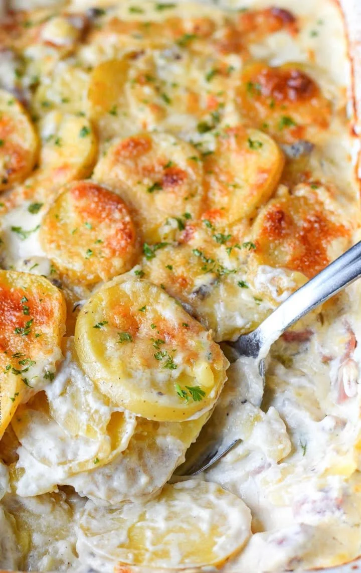 Parmesan Scalloped Potatoes with Ham Delicious Parmesan scalloped potatoes with ham, perfect for a comforting meal.