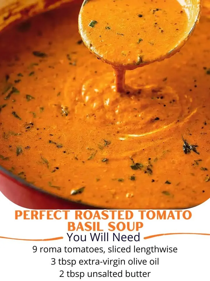 Bowl of perfect roasted tomato basil soup garnished with fresh basil leaves