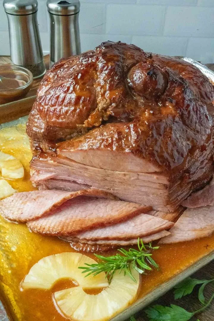 Pineapple Glazed Ham Delicious Pineapple Glazed Ham served on a festive table.