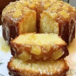 Delicious slice of Pineapple Pound Cake topped with fresh pineapple slices