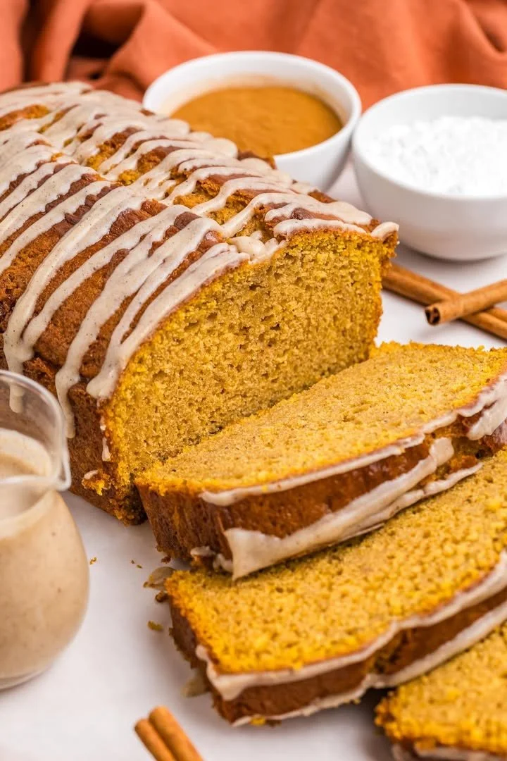 Deliciously moist Pumpkin Pound Cake topped with cream and spices
