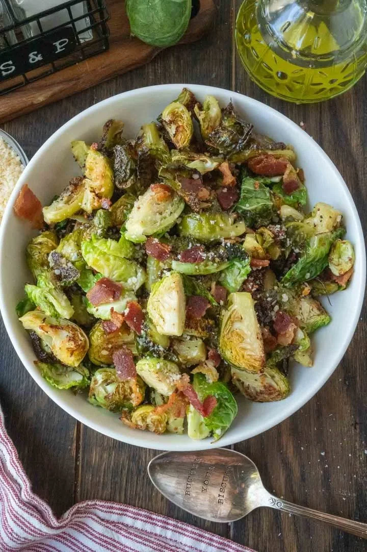 Delicious roasted Brussels sprouts with crispy bacon on a serving plate