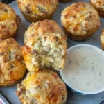 home Delicious sausage muffins served with creamy gravy on a plate