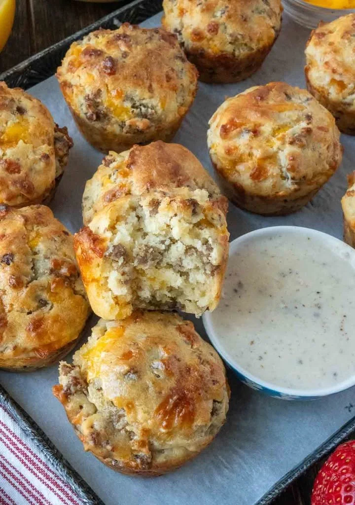 Delicious sausage muffins served with creamy gravy on a plate