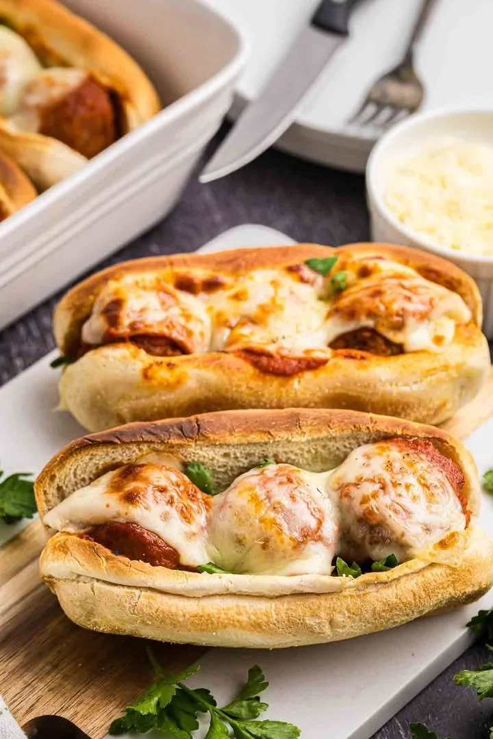Slow cooker meatball subs with marinara sauce on hoagie rolls