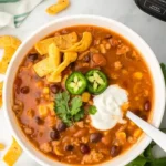 home Bowl of flavorful slow cooker taco soup topped with avocado and cilantro