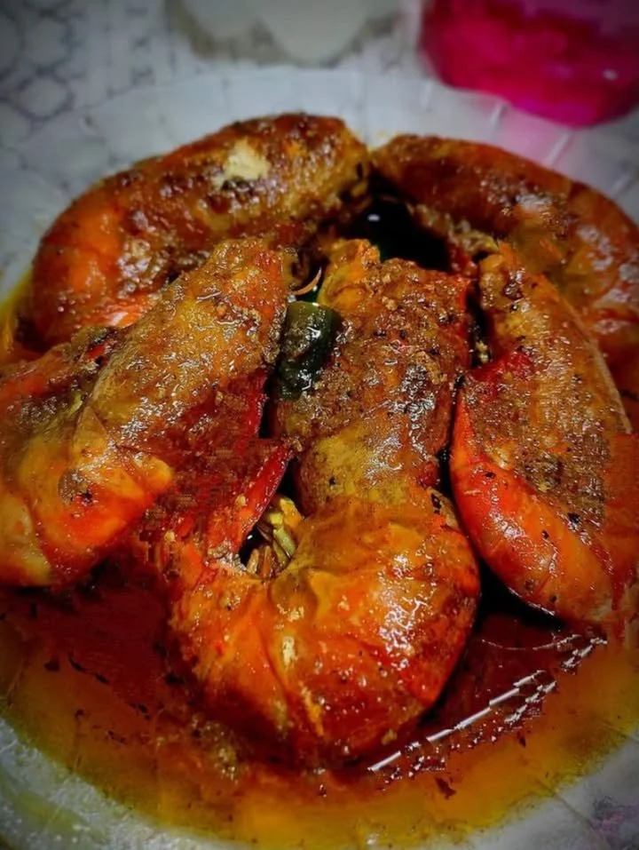 Delicious spicy masala prawns served with herbs and spices