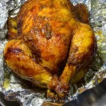 Delicious stuffed chicken ready to be served with vibrant vegetables.