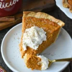 Homemade Sweet Potato Pie with whipped cream topping