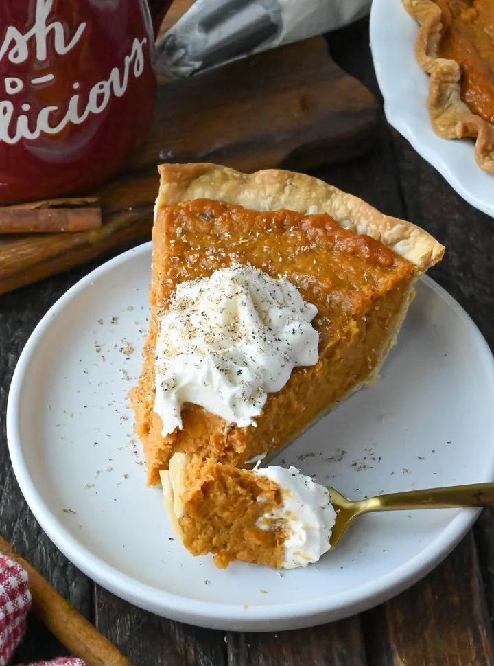 Homemade Sweet Potato Pie with whipped cream topping