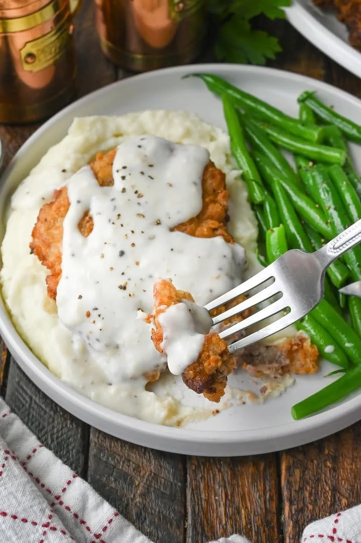 Delicious Texas Roadhouse Chicken Fried Steak served with gravy and sides