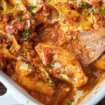 Baked Cheese Stuffed Shells served with marinara sauce and topped with cheese