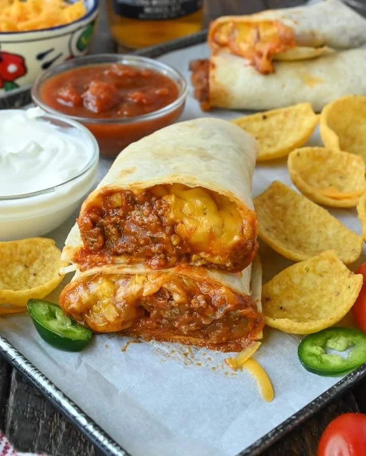 Chili Cheese Burrito with cheese and chili sauce on a plate