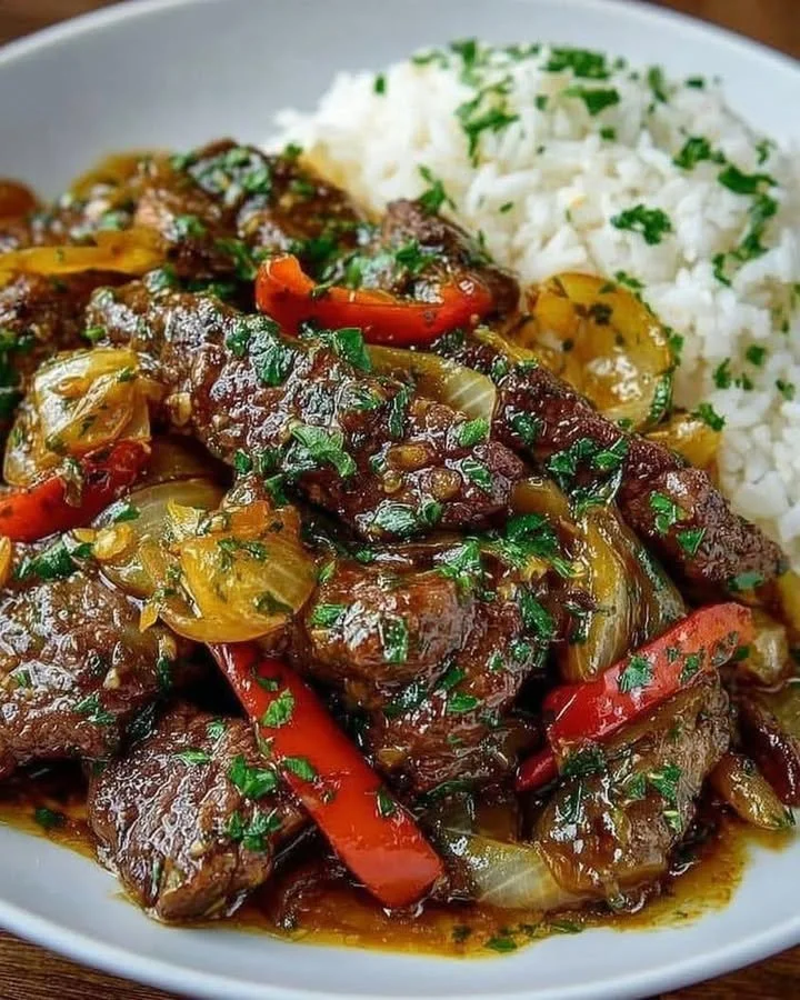 Chinese Pepper Steak with Onions Delicious Chinese pepper steak with onions served on a plate