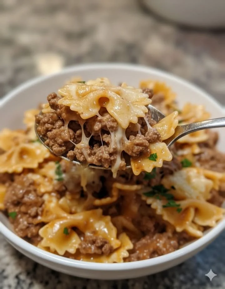 home Creamy ground beef bowtie pasta topped with Alfredo sauce