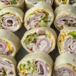 home Delicious high roller pinwheel sandwiches arranged on a platter